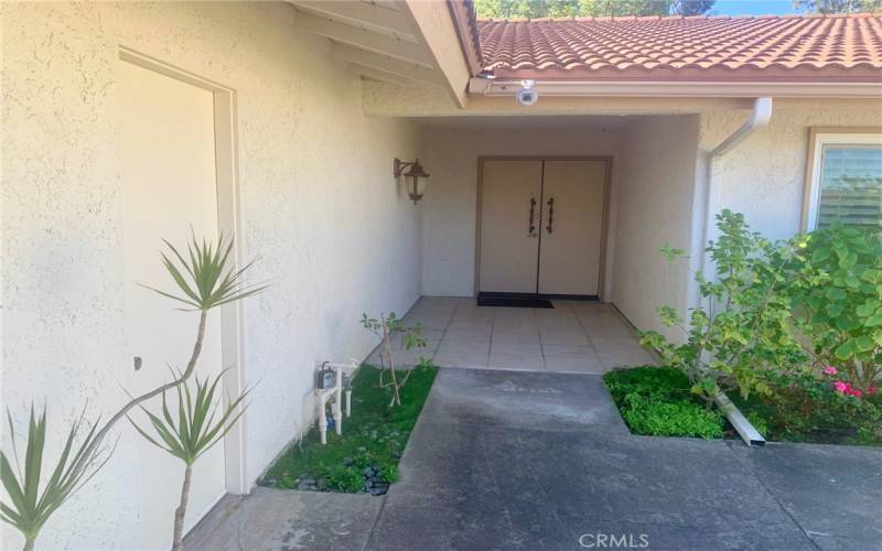 Front door of residence. Service door to the two-car garage can be seen at far left.