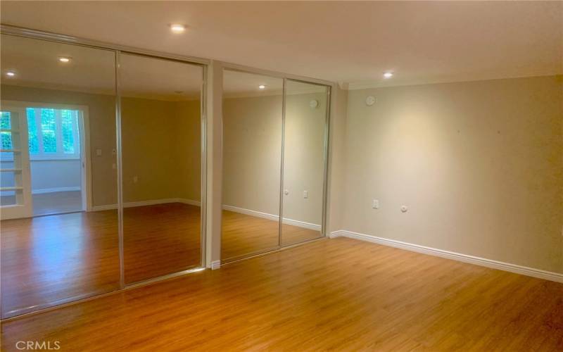 Another view of the primary bedroom. Note the ample closet storage.