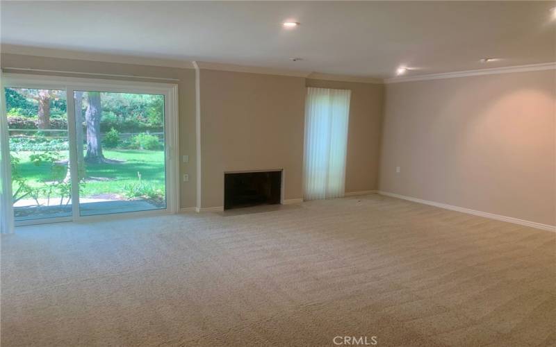 Large living room. Note the sliding glass door at left that opens to an enormous back yard that is maintained by the Mutual.