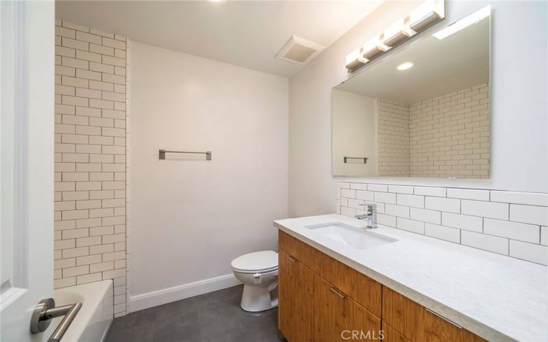 Wonderful tub enhanced bathroom.