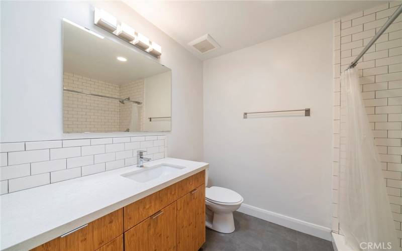 This bathroom features a walk in shower.