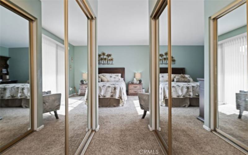 Dual Closets with Mirrored Wardrobe Doors