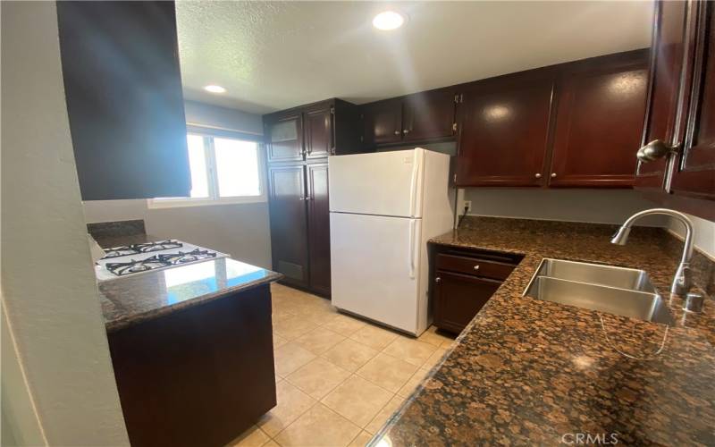 Kitchen with refrigerator