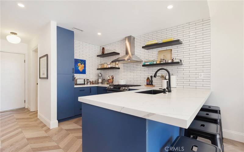 Kitchen was completely remodeled and expanded to provide extra seating at the breakfast bar