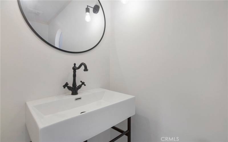 Fully remodeled downstairs powder room with new vanity, fixtures and toilet