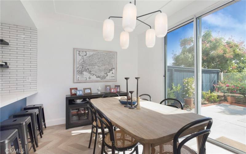 Separate Dining Area and a breakfast bar. Notice the Custom lighting fixtures from William Sonoma and those are on dimmers.