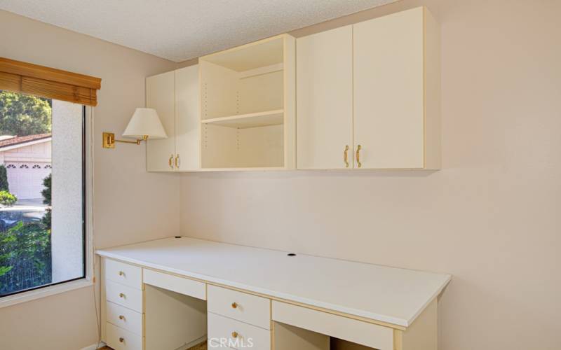 Shelving and desk in guest bedroom.