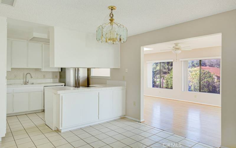 Close-up view of the kitchen. Large multipurpose bonus room can be seen at right.