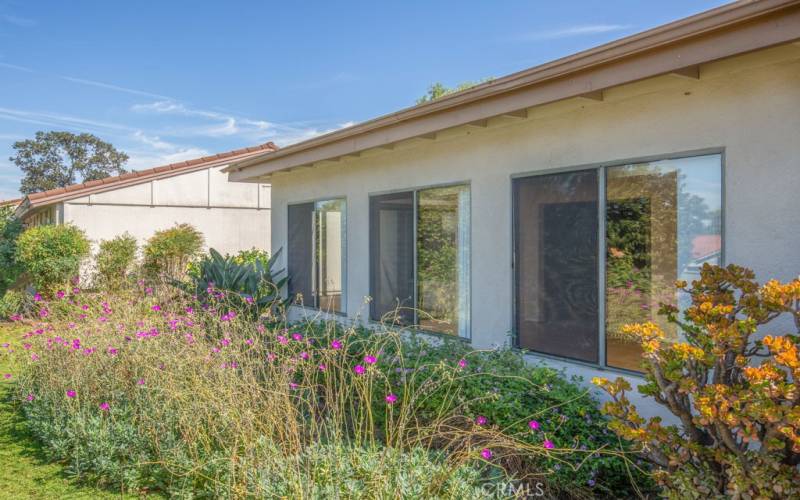 Another view of the rear of the residence. Note the gorgeous landscaping.