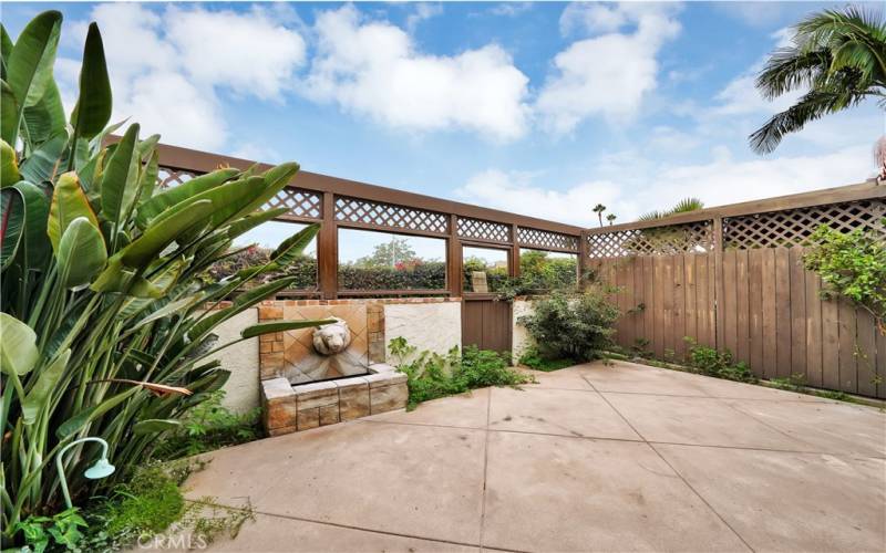 Enclosed patio, with fountain.