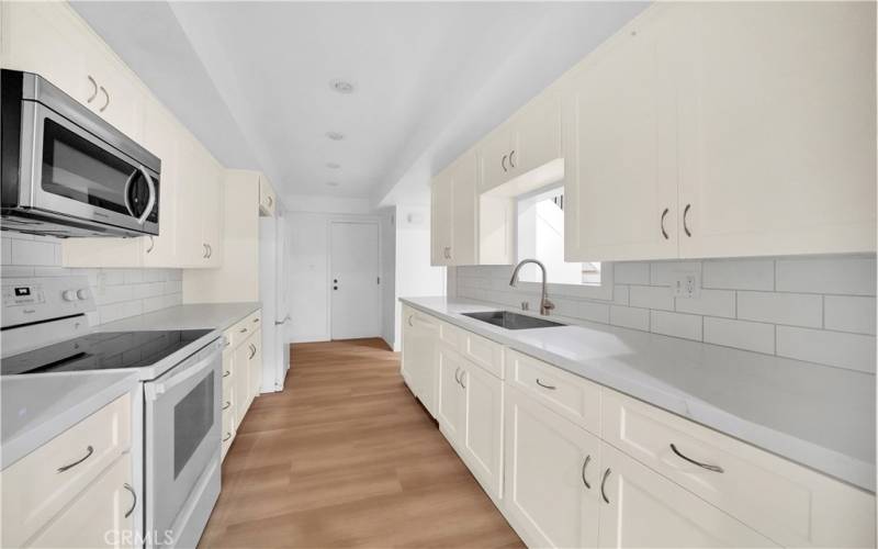 Kitchen has a pass through window to the dining area.