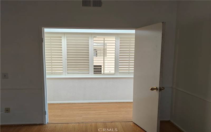 Secondary bedroom entryway under skylight