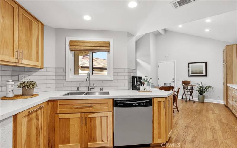 The window over the sink looks out to the front courtyard.