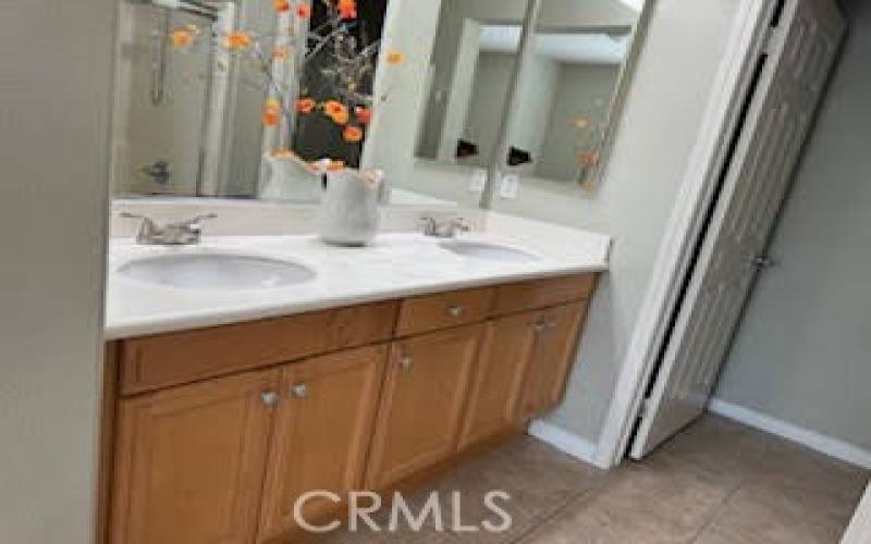 Primary bathroom with dual vanities