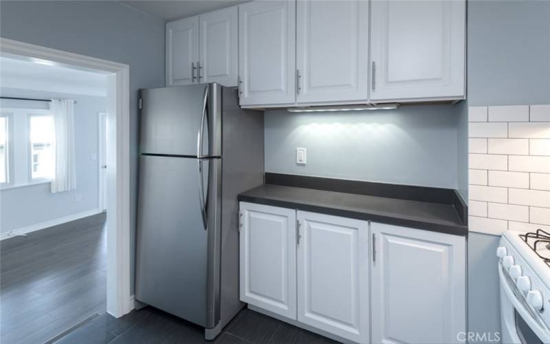 Kitchen looking into living room