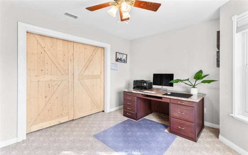 4th bedroom / home office with barn doors closed.