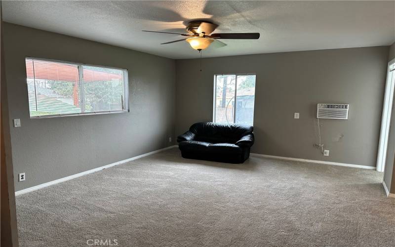 Master Bedroom Suite with walk-in closet, access to backyard and its own bathroom.  This room was just freshly painted and had the carpet replaced.  The air conditioner in the window belongs to tenant and will be removed.  The house has central A/C and heating.