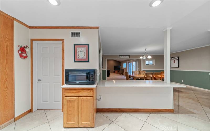 Kitchen opening into dining room