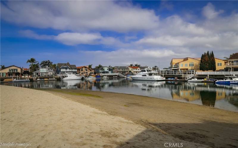 Your private beach with soft sand and a family style setting.