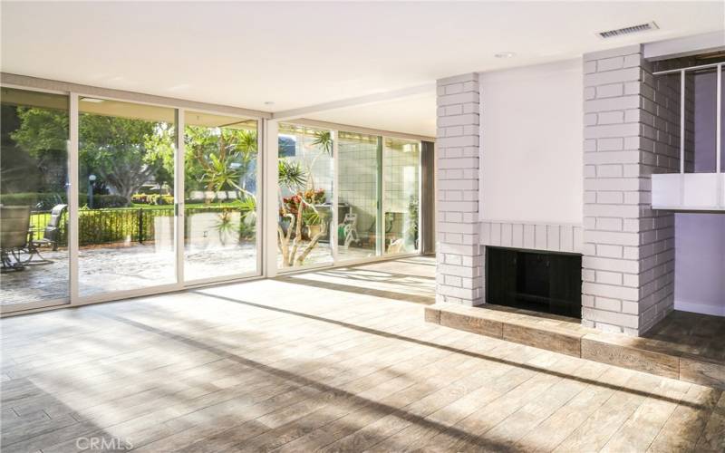 Living room features a full wall of windows.