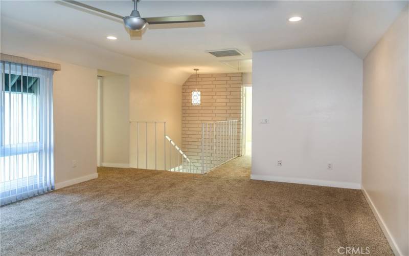 Private upstairs bedroom with ceiling fan to waft the cool ocean breeze.