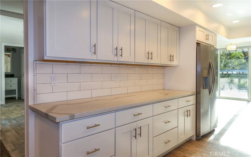 Custom cabinetry and brand new fridge. Tons of storage space!