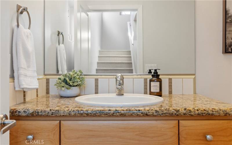 Second floor powder room with sink and toilet.