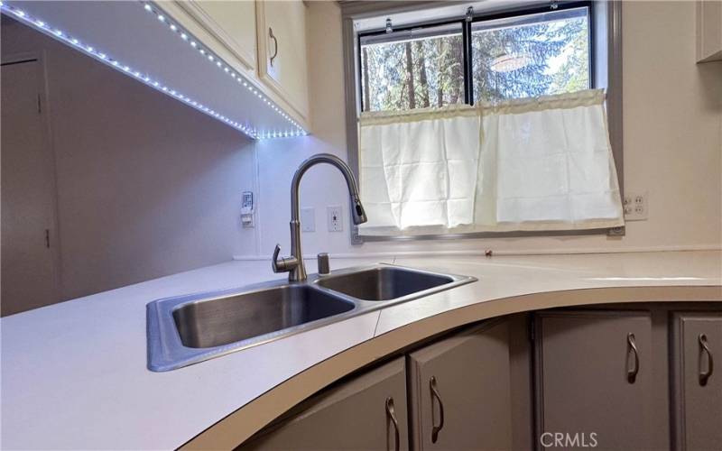 kitchen sink and additional lighting for interest