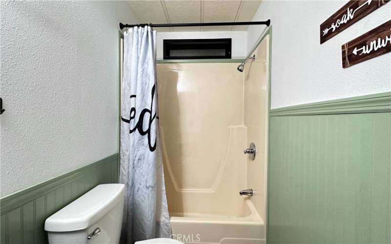 guest bath with tub and shower