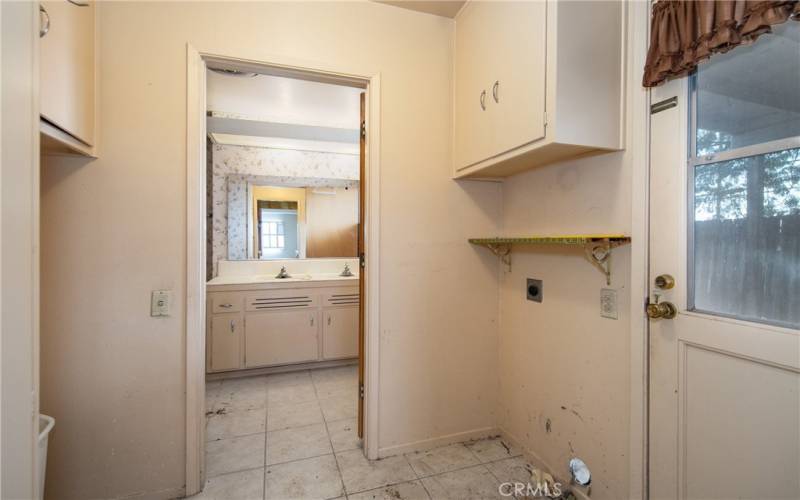 Laundry Room with direct access to the backyard and Hallway bathroom