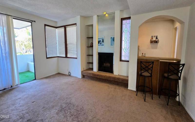 Living room and view towards patio