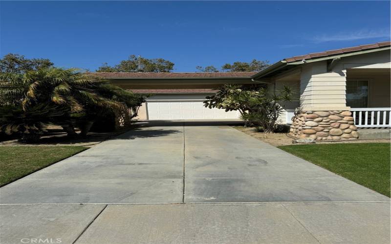 Connected Garage, porte cochere and long driveway.