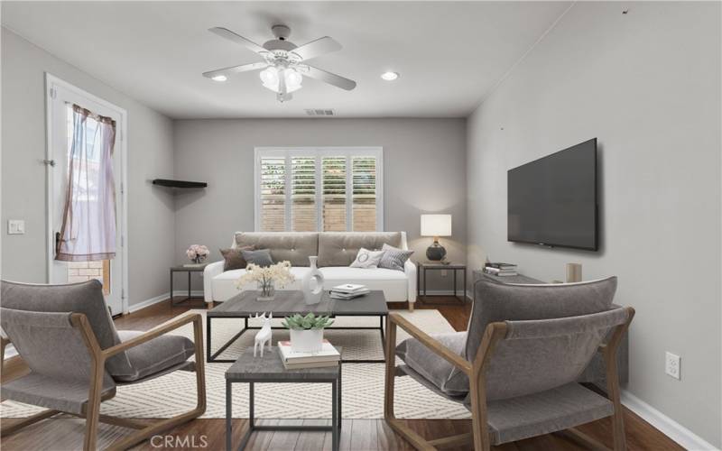 Downstairs living area virtually staged to show its potential.