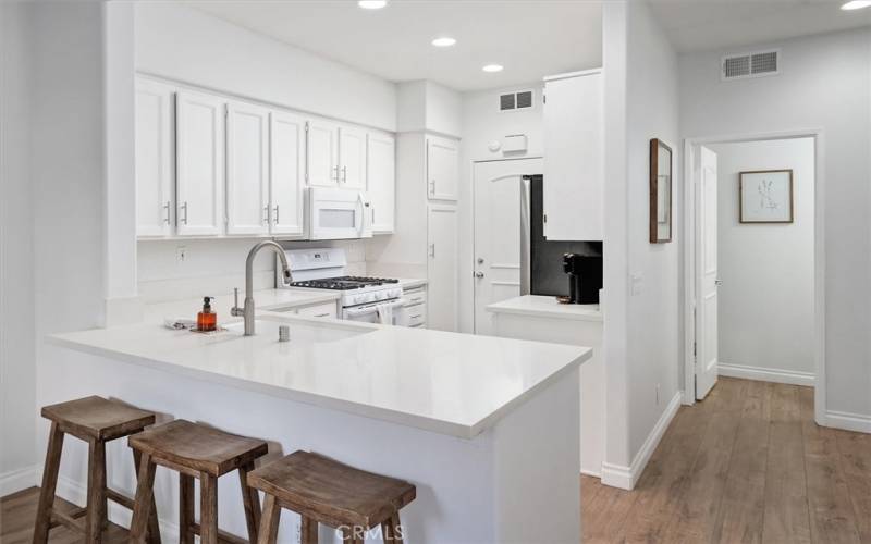 Breakfast bar open to dining and family room