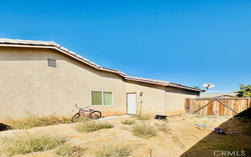 Direct access from the garage to the backyard. Large wood gate.