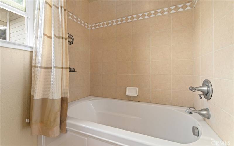 Hall bath with shower over tub