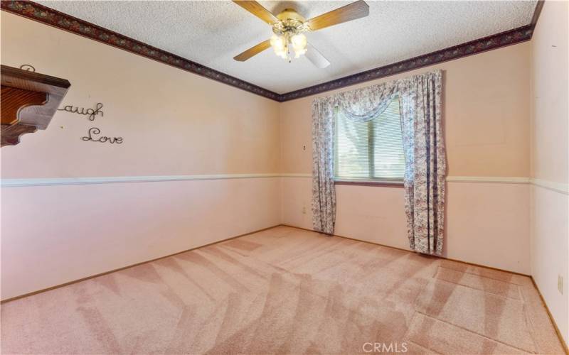 This room faces the front yard and first on the left side from the hallway.