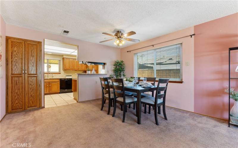 Spacious dining with cabinets to the right. Double paned windows faces the side. Pass through wall from stove in kitchen.