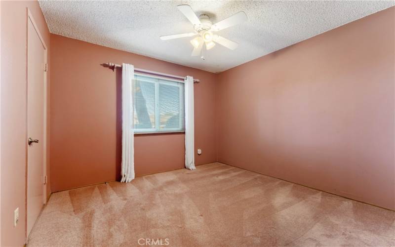 One of four bedrooms. This one faces the front yard and opposite from the primary bedroom.