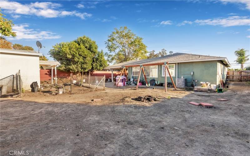 View from back yard to front house (RV parking w/cleanout)