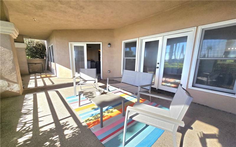 Relaxing front patio with access from the living room and primary bedroom.