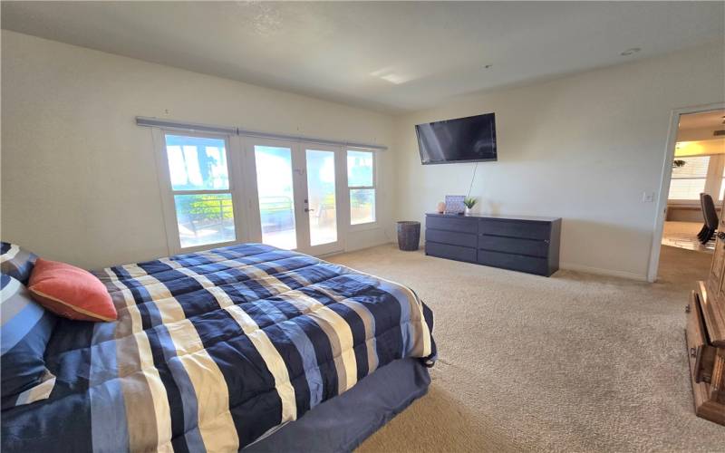 Primary bedroom with access to the front patio.