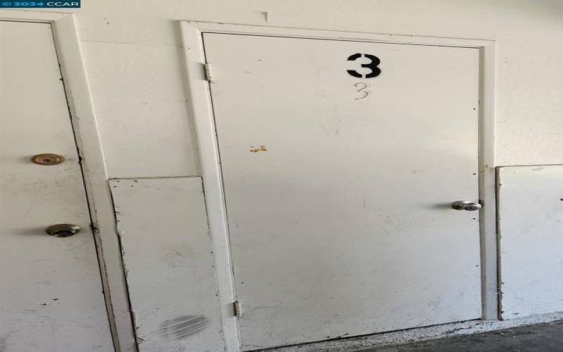 Door to Storage Closet inside garage