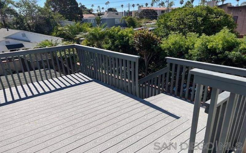 Upstairs deck overlooking backyard