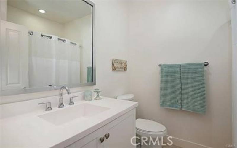 Upstairs, guest bathroom with tub and shower