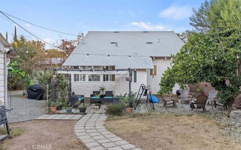 Private backyard with pergola sitting area