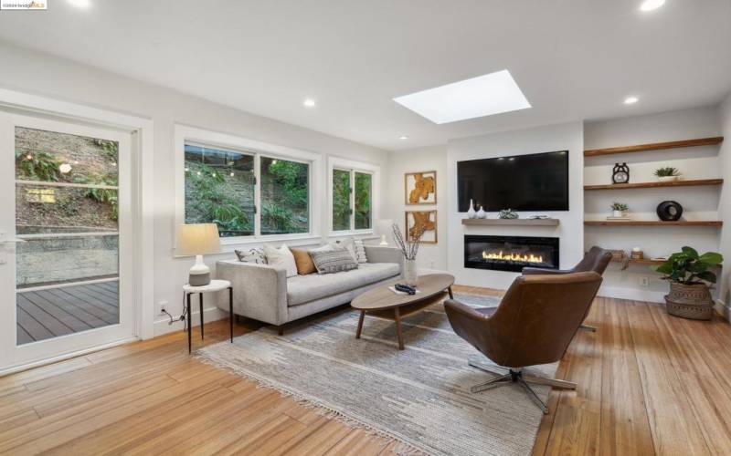 Living room features large windows.