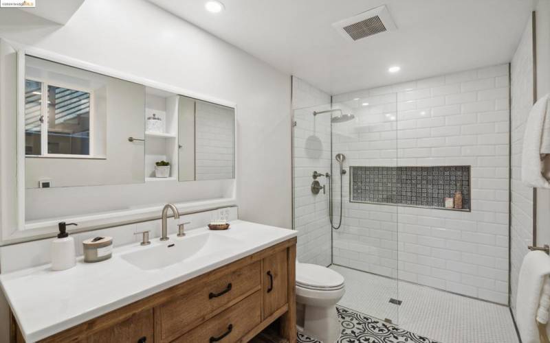 Primary bathroom features a walk-in shower.