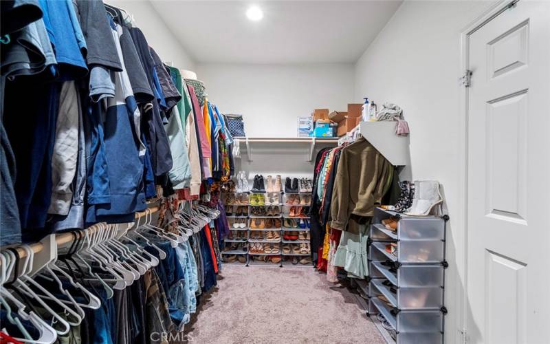 Primary bedroom walk-in closet