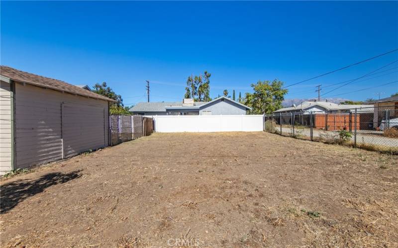 fenced off lot to alley